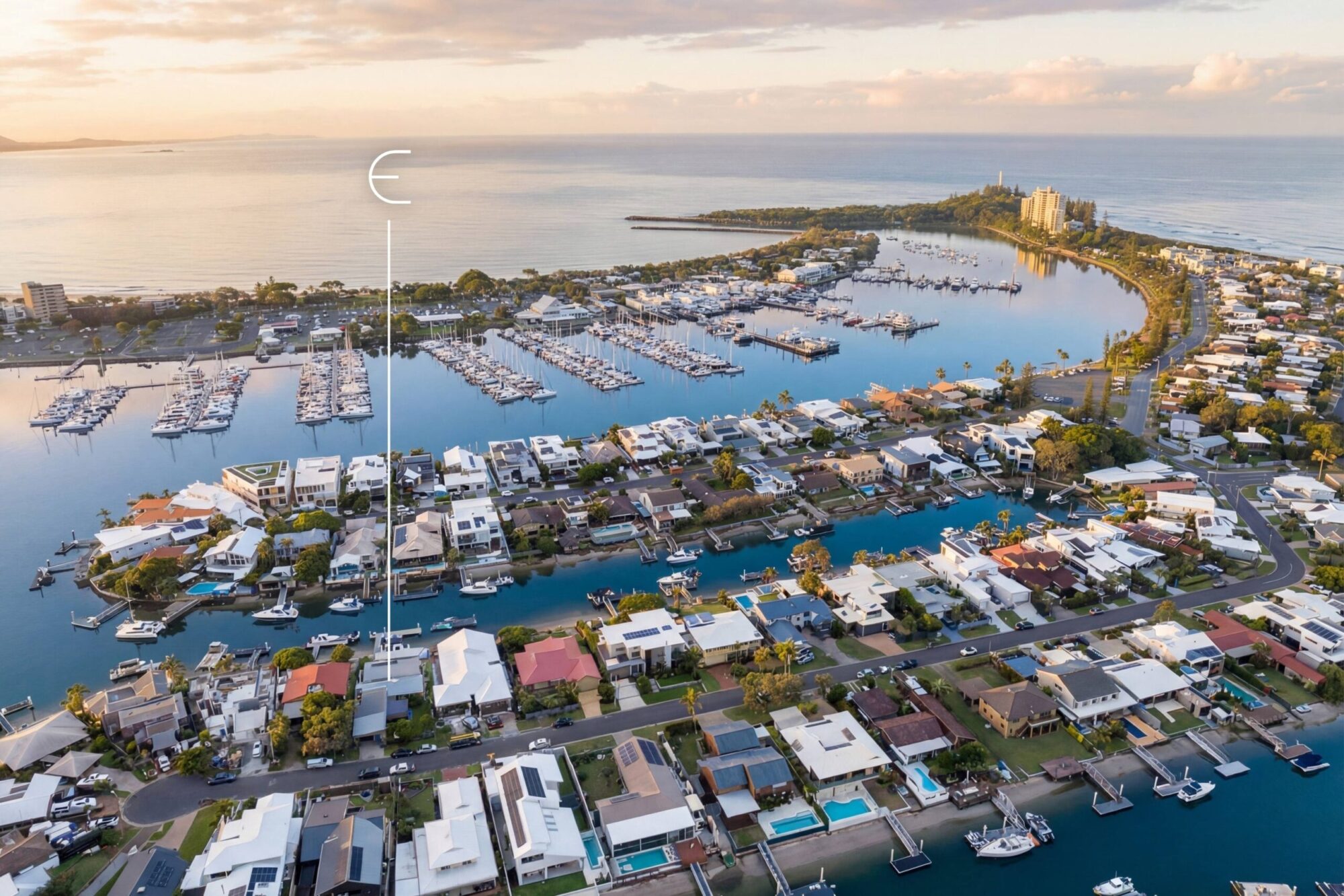 Aerial view over Buddina's canals towards the Mooloolah River mouth at dusk